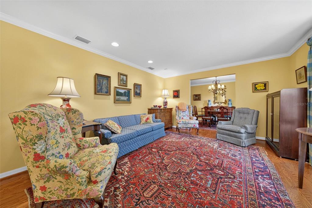 1053 Sweetbriar Road Orlando, FL 32806 - Photo 25 of 79 a living room with furniture windows and a flat screen tv