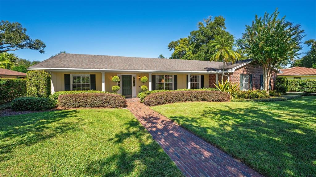 1053 Sweetbriar Road Orlando, FL 32806 - Photo 3 of 79 a front view of a house with a yard