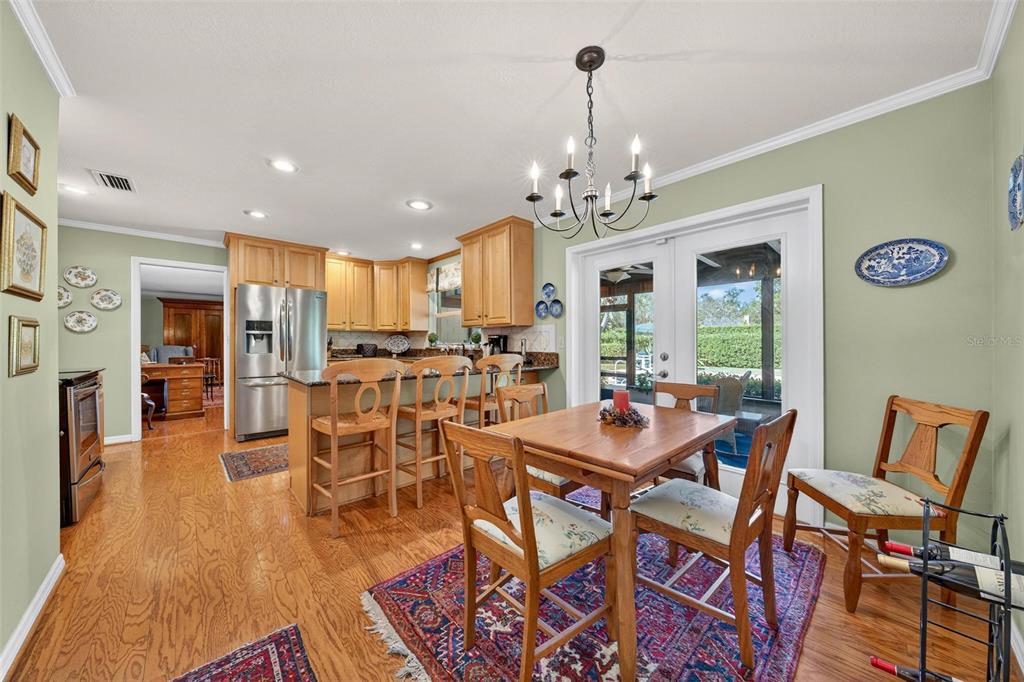 1053 Sweetbriar Road Orlando, FL 32806 - Photo 40 of 79 a view of a dining room with furniture and wooden floor