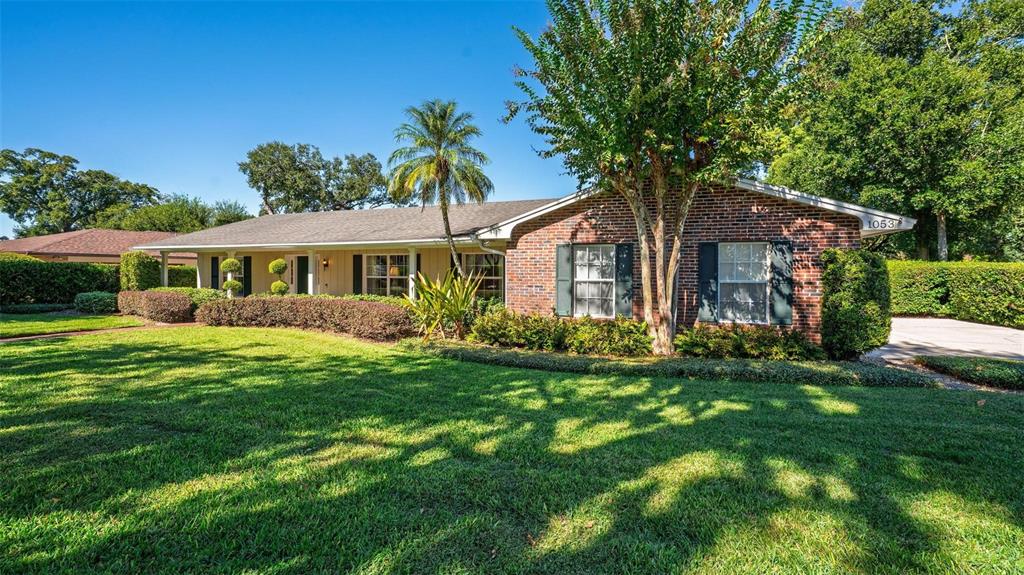 1053 Sweetbriar Road Orlando, FL 32806 - Photo 4 of 79 a front view of a house with a yard