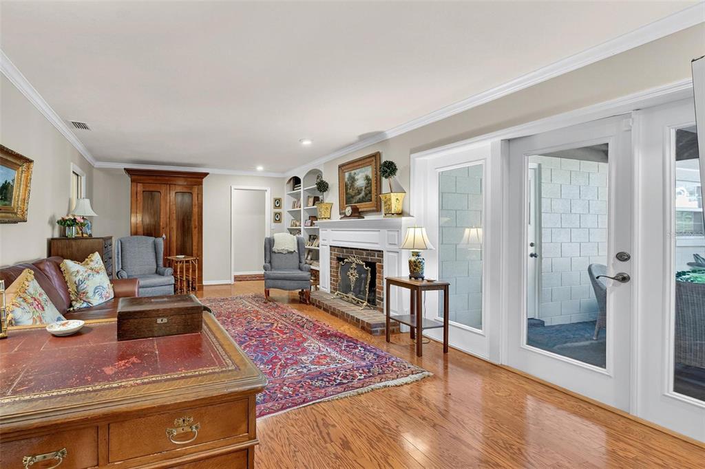 1053 Sweetbriar Road Orlando, FL 32806 - Photo 46 of 79 a living room with furniture and a fireplace