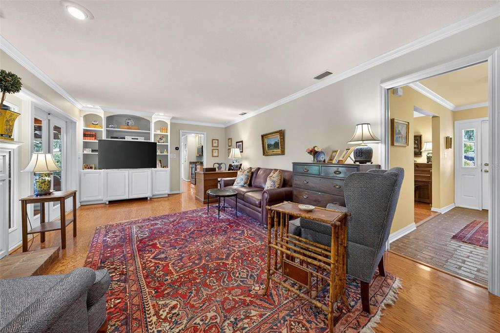 1053 Sweetbriar Road Orlando, FL 32806 - Photo 48 of 79 a living room with furniture and a flat screen tv