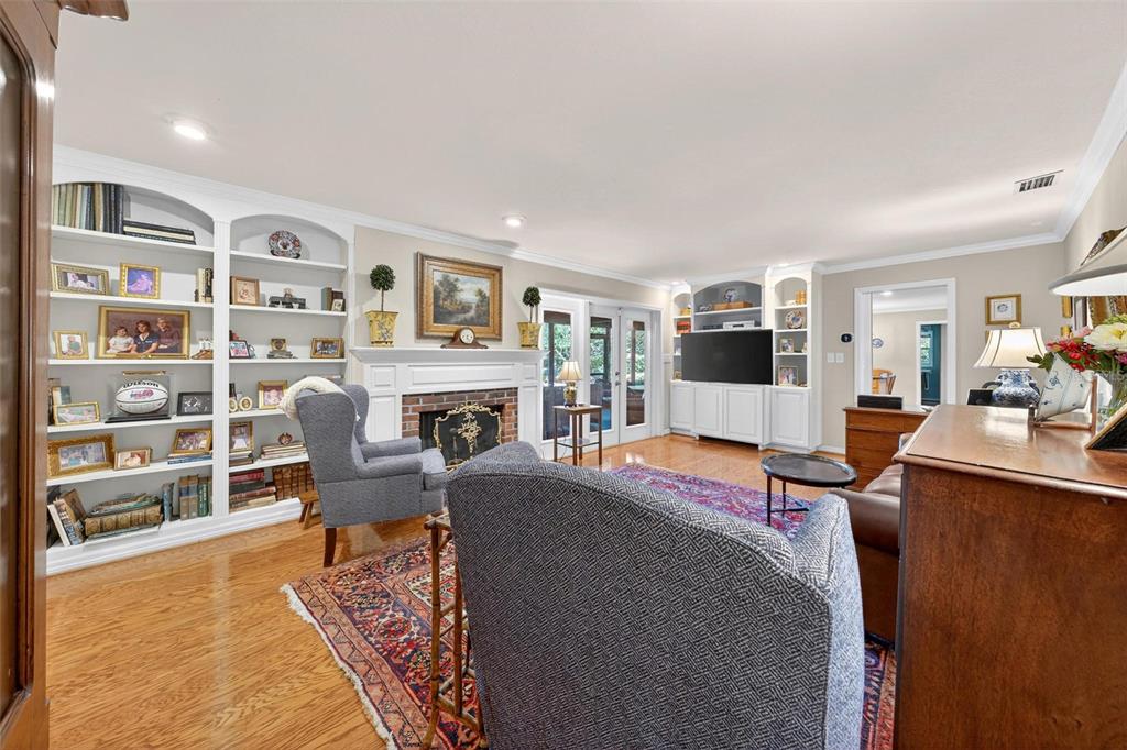 1053 Sweetbriar Road Orlando, FL 32806 - Photo 50 of 79 a living room with furniture fireplace and flat screen tv
