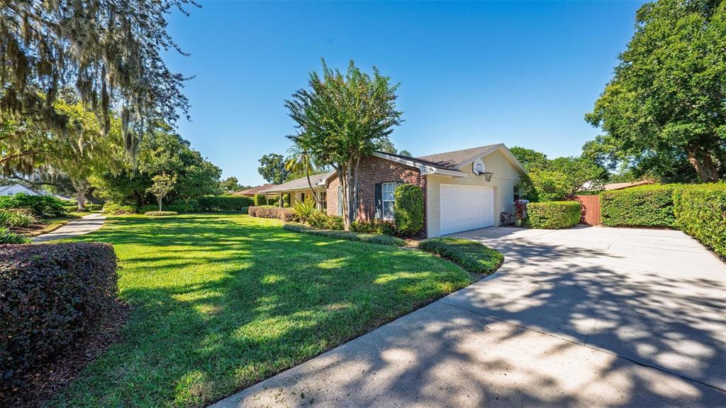1053 Sweetbriar Road Orlando, FL 32806 - Photo 5 of 79 a front view of a house with a yard