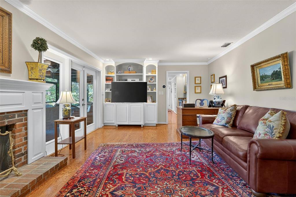 1053 Sweetbriar Road Orlando, FL 32806 - Photo 51 of 79 a living room with furniture and a flat screen tv