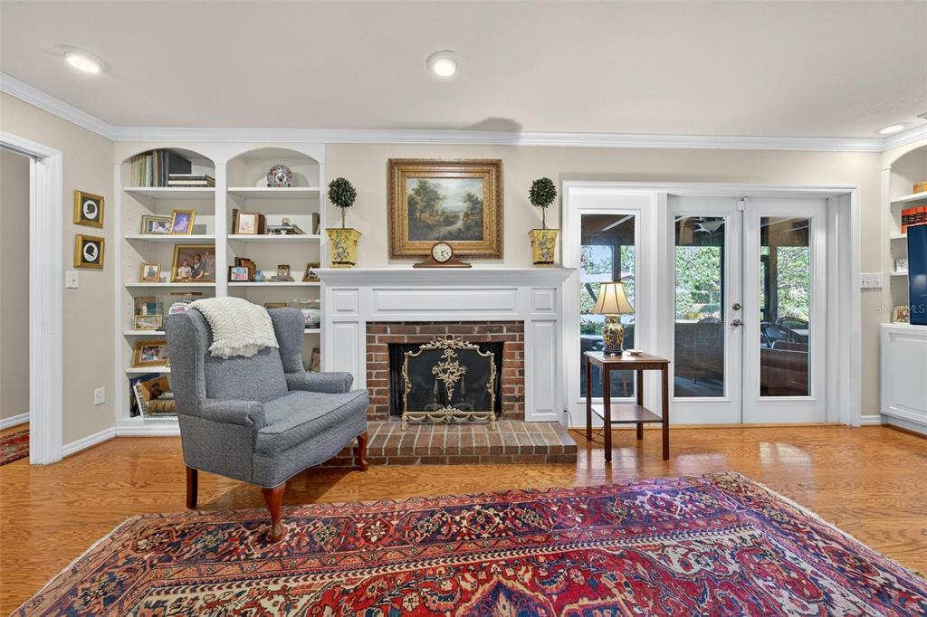 1053 Sweetbriar Road Orlando, FL 32806 - Photo 52 of 79 a living room with furniture and a fireplace