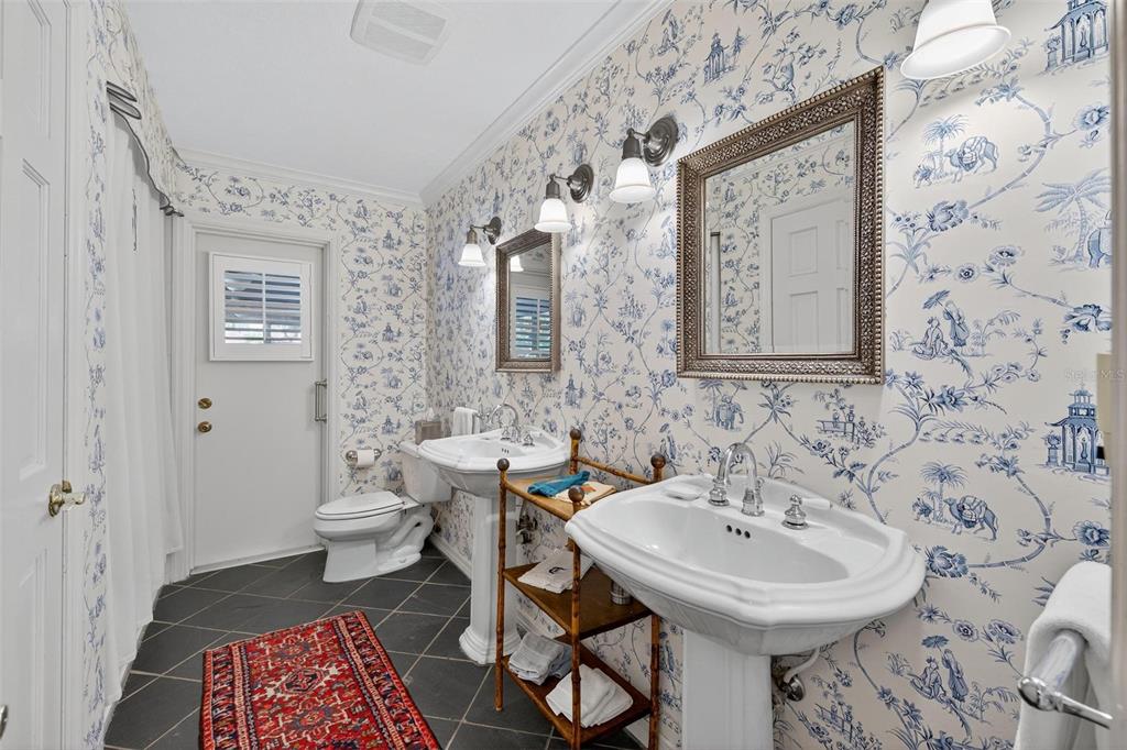 1053 Sweetbriar Road Orlando, FL 32806 - Photo 54 of 79 a bathroom with a sink toilet and a mirror