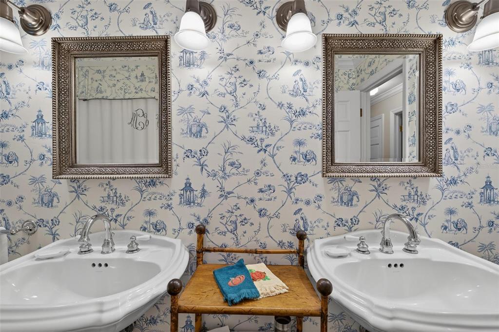 1053 Sweetbriar Road Orlando, FL 32806 - Photo 55 of 79 a bathroom with a sink and a mirror