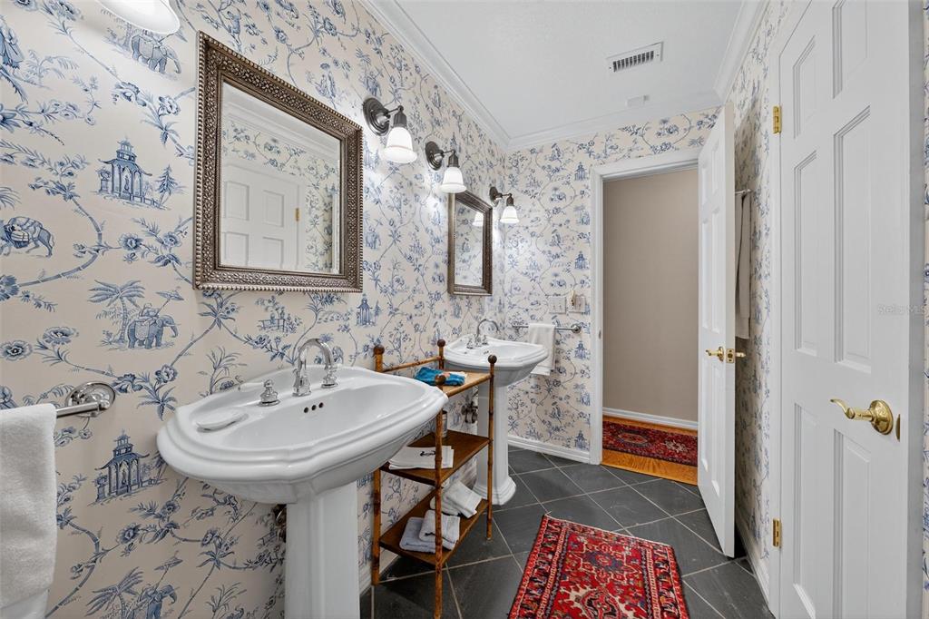 1053 Sweetbriar Road Orlando, FL 32806 - Photo 56 of 79 a bathroom with a sink and a mirror