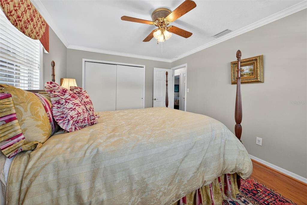 1053 Sweetbriar Road Orlando, FL 32806 - Photo 63 of 79 a bedroom with a bed and a chandelier