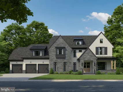 a front view of a house with a garden and yard