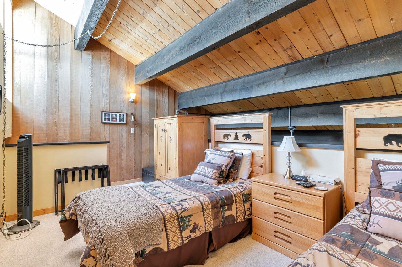 1001 Commonwealth Drive, Unit 156 Kings Beach, CA 96143 - Photo 11 of 21 a bedroom with a bed and a potted plant