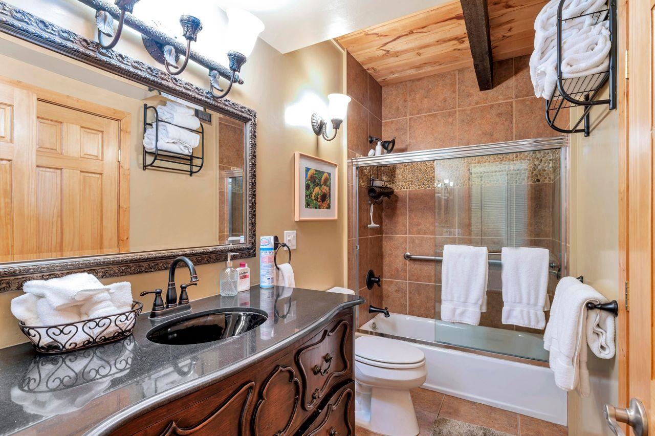 1001 Commonwealth Drive, Unit 156 Kings Beach, CA 96143 - Photo 12 of 21 a bathroom with a sink toilet and shower