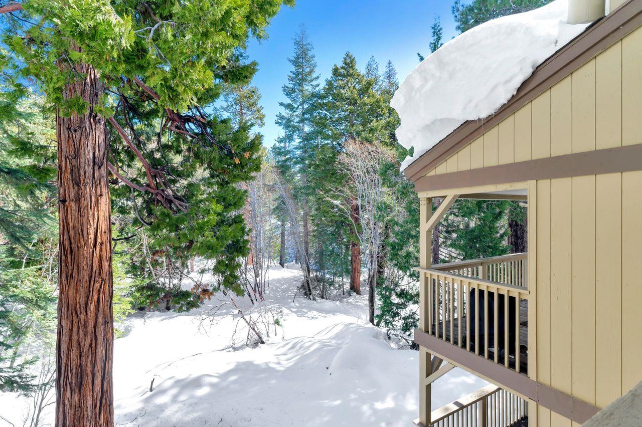 1001 Commonwealth Drive, Unit 156 Kings Beach, CA 96143 - Photo 17 of 21 a view of a porch with wooden floor and fence