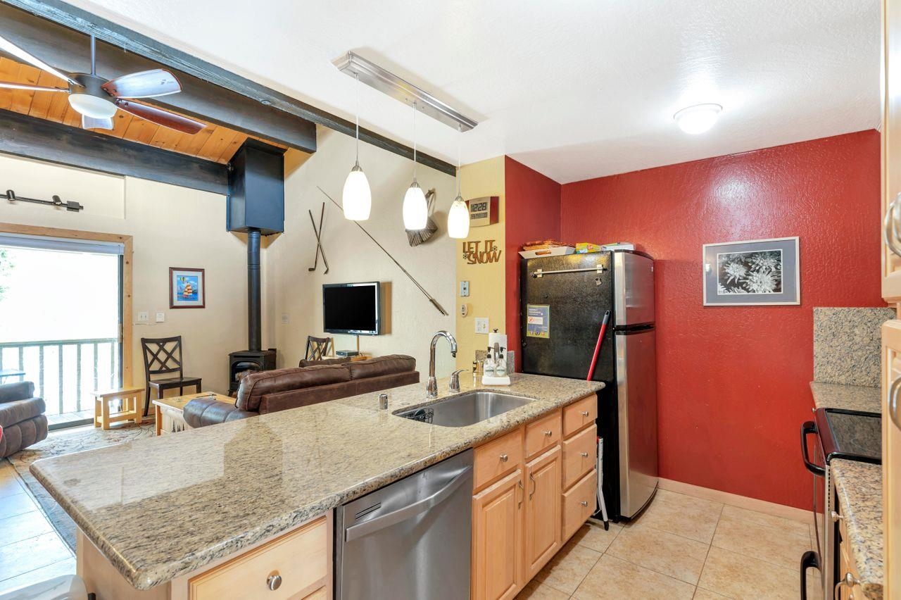 1001 Commonwealth Drive, Unit 156 Kings Beach, CA 96143 - Photo 5 of 21 a bathroom with sinks granite countertop a sink and a mirror