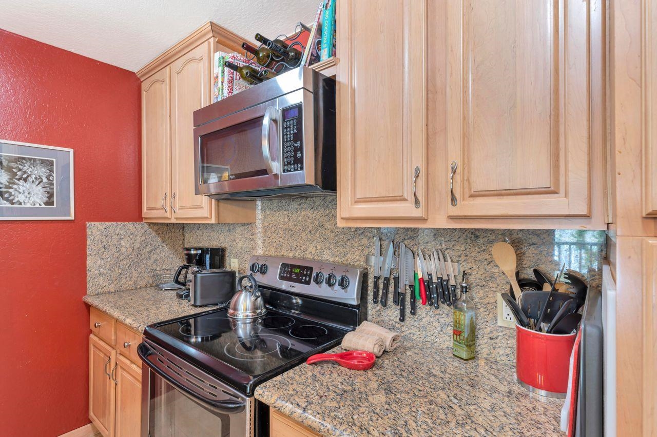 1001 Commonwealth Drive, Unit 156 Kings Beach, CA 96143 - Photo 6 of 21 a kitchen with stainless steel appliances granite countertop a sink stove and cabinets
