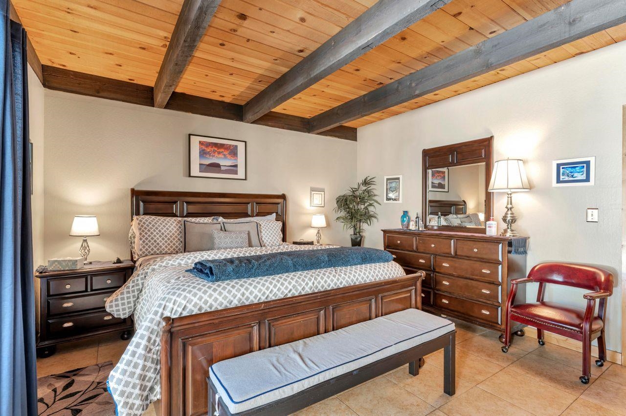 1001 Commonwealth Drive, Unit 156 Kings Beach, CA 96143 - Photo 8 of 21 a bedroom with a bed and a furniture