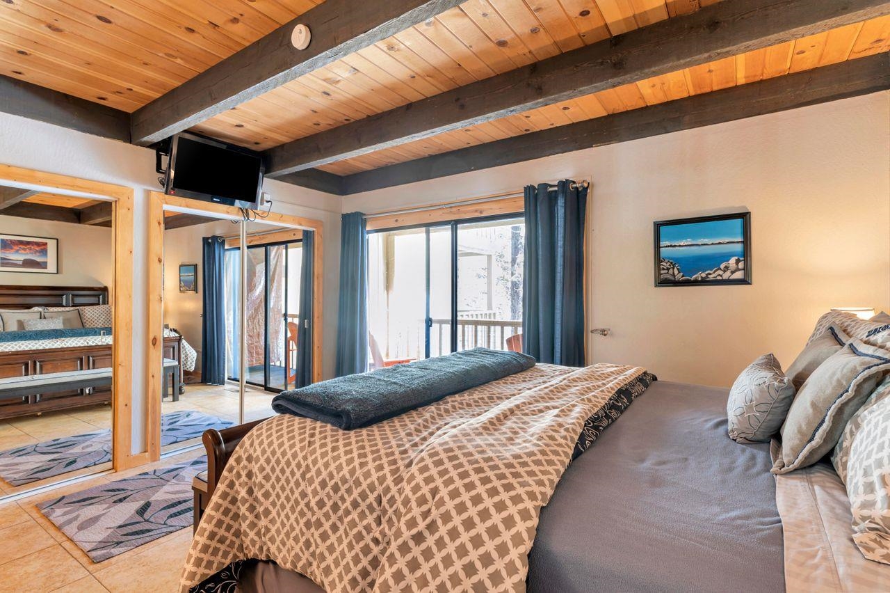 1001 Commonwealth Drive, Unit 156 Kings Beach, CA 96143 - Photo 9 of 21 a bedroom with a bed next to a window