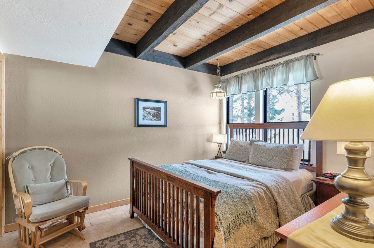 1001 Commonwealth Drive, Unit 156 Kings Beach, CA 96143 - Photo 10 of 21 a bedroom with a bed chair and a window