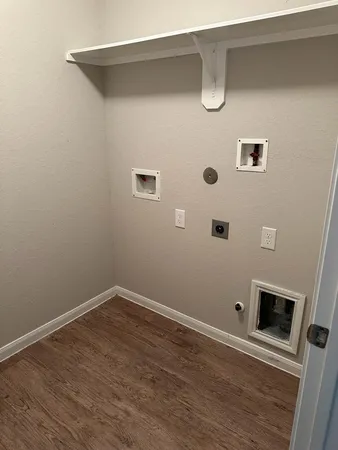 a view of a door with wooden floor
