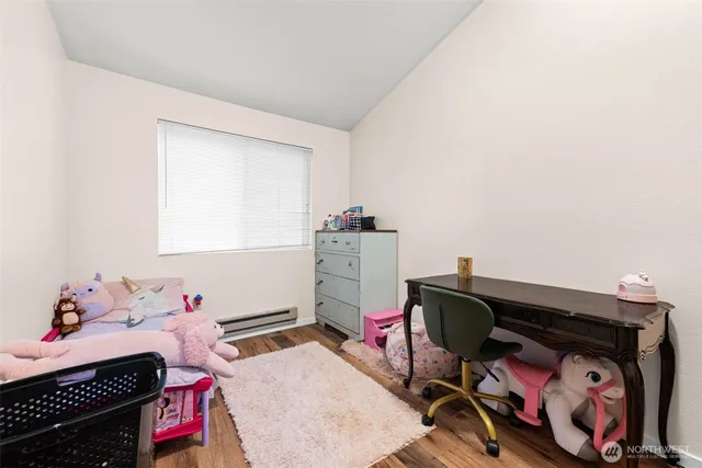 a bedroom with a bed and cabinets