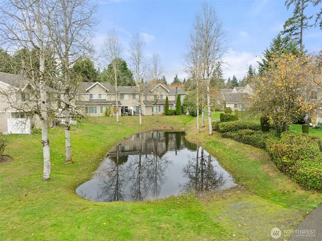 a view of a water fountain in front of the house