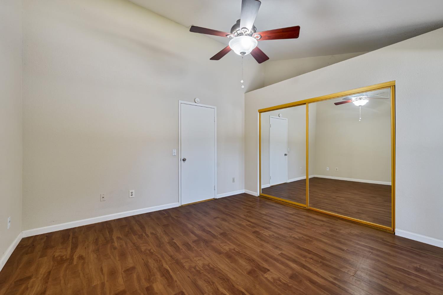 9237 Madison Avenue Orangevale, CA 95662 - Photo 18 of 40 an empty room with wooden floor fan and windows