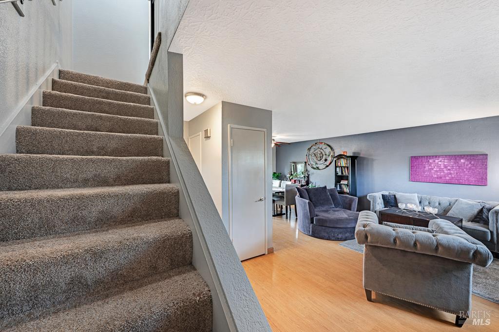 1749 Las Raposas Court Santa Rosa, CA 95409 - Photo 15 of 31 a living room with furniture and stairs