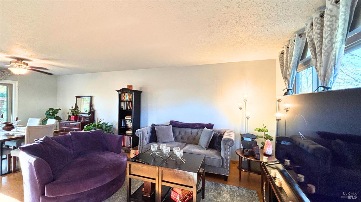 1749 Las Raposas Court Santa Rosa, CA 95409 - Photo 5 of 31 a living room with furniture and a fireplace