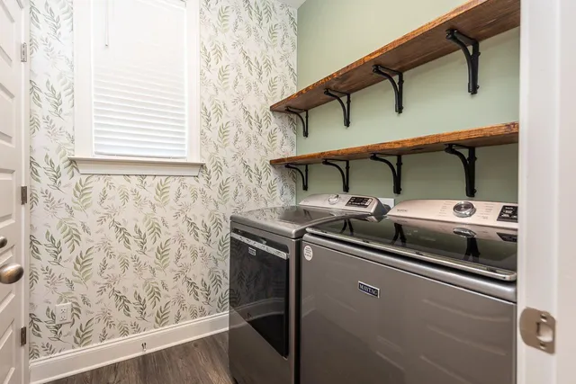 a spacious bathroom with a tub sink and mirror