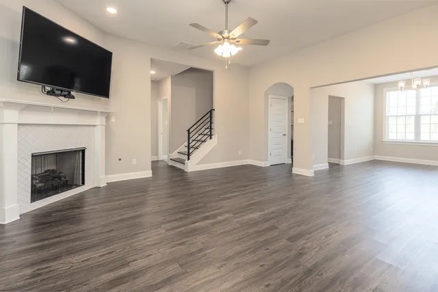 a view of a livingroom with an empty space and a fireplace