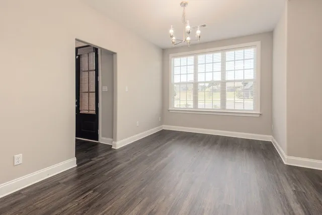 an open kitchen with a table and chairs in it