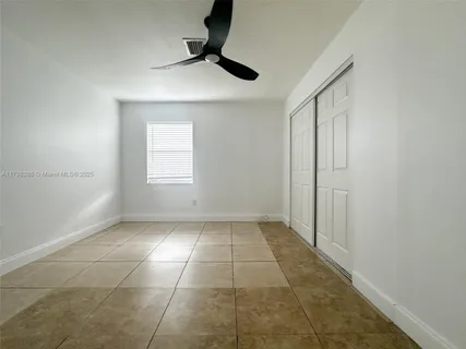 a view of a kitchen with a sink and a window