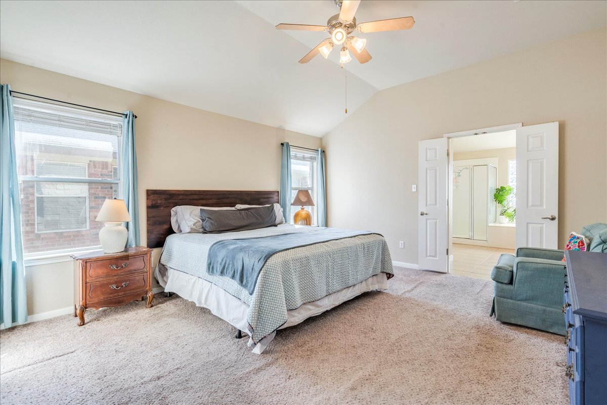 18424 Dry Brook Loop Pflugerville, TX 78660 - Photo 16 of 25 Bedroom with light carpet, vaulted ceiling, and ceiling fan