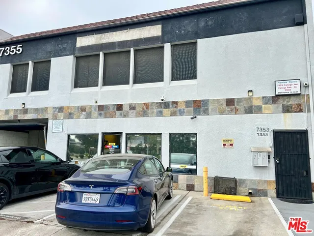 a living room with a couch and dresser