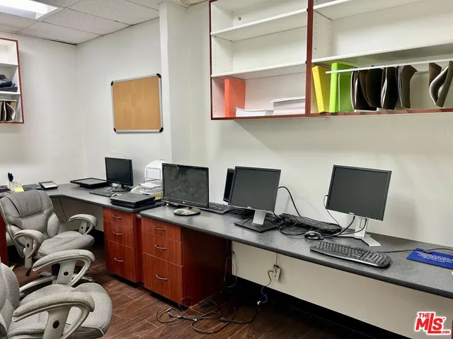 a view of a workspace with furniture