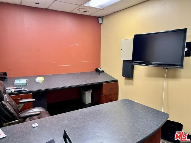 a living room with a flat screen tv