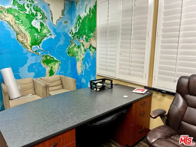 a view of a workspace with furniture