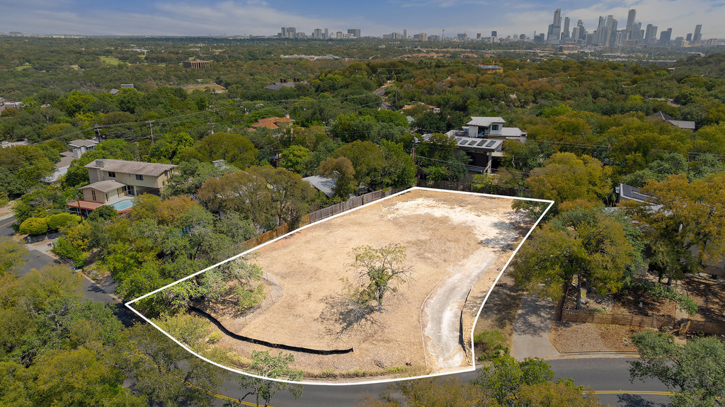 Prime buildable lot with generous footprint, mature trees, and sweeping views toward the Austin skyline. Perfect opportunity to create a custom home in a highly desirable neighborhood with convenient access to downtown.