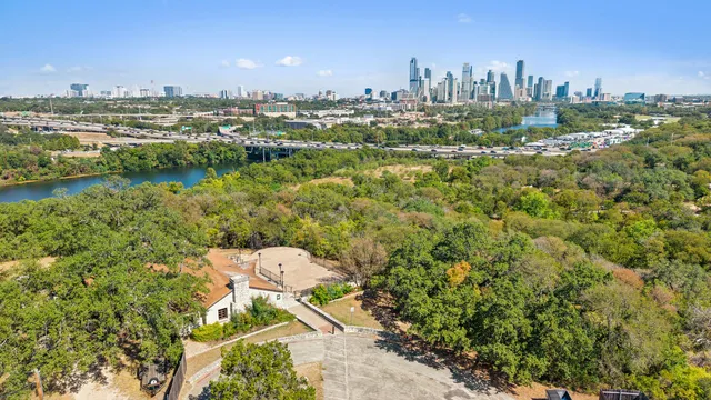 an aerial view of a forest with houses