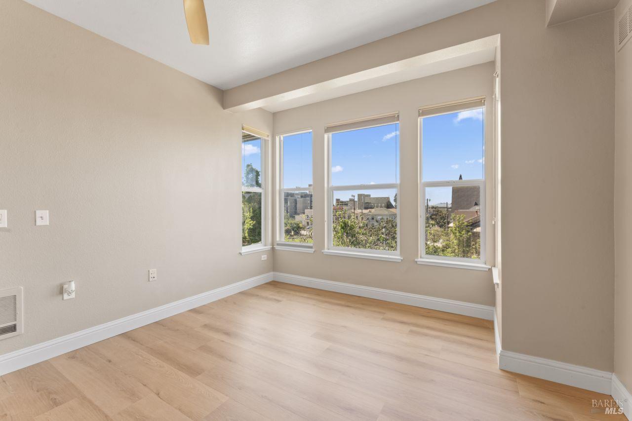 655 12th Street, Unit 311 Oakland, CA 94607 - Photo 16 of 29 an empty room with windows and closet