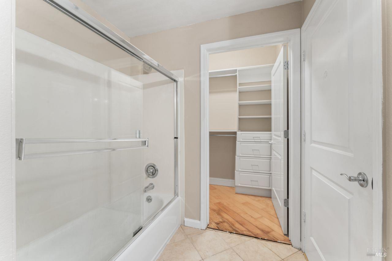 655 12th Street, Unit 311 Oakland, CA 94607 - Photo 22 of 29 a bathroom with a bathtub and shower