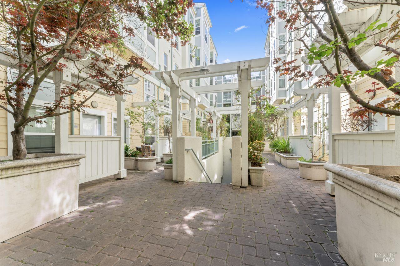655 12th Street, Unit 311 Oakland, CA 94607 - Photo 26 of 29 a view of a house with a yard
