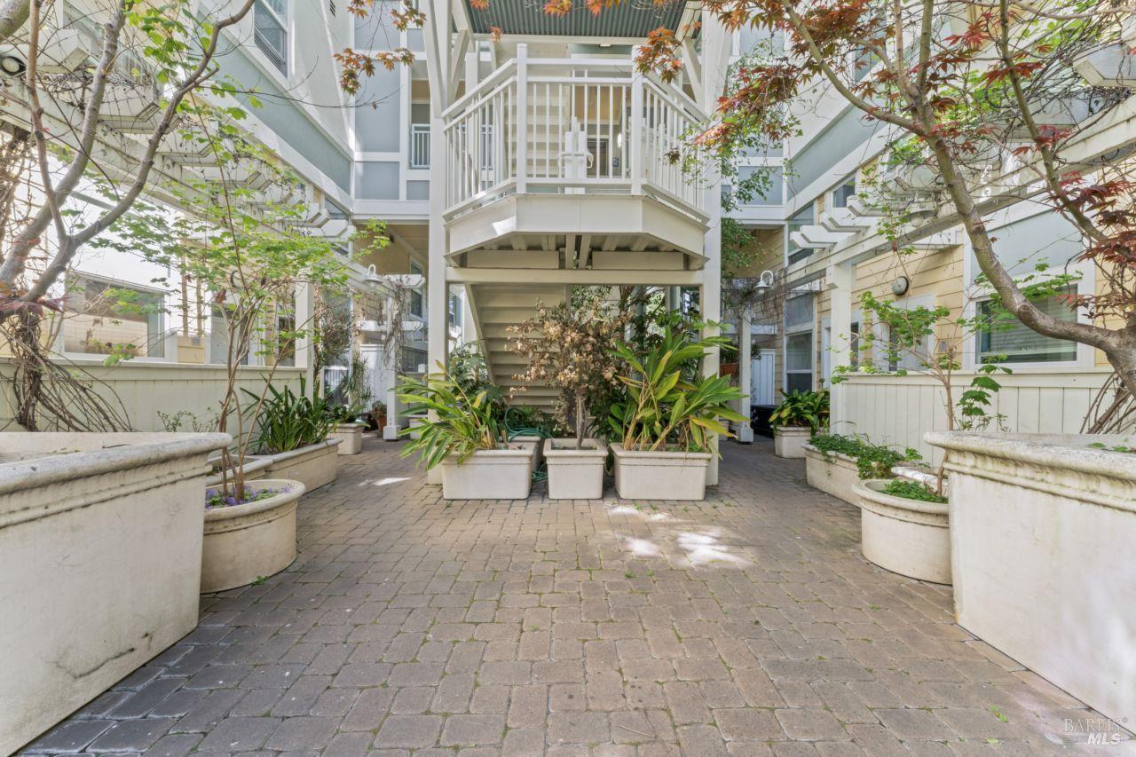 655 12th Street, Unit 311 Oakland, CA 94607 - Photo 27 of 29 a view of a building with many windows