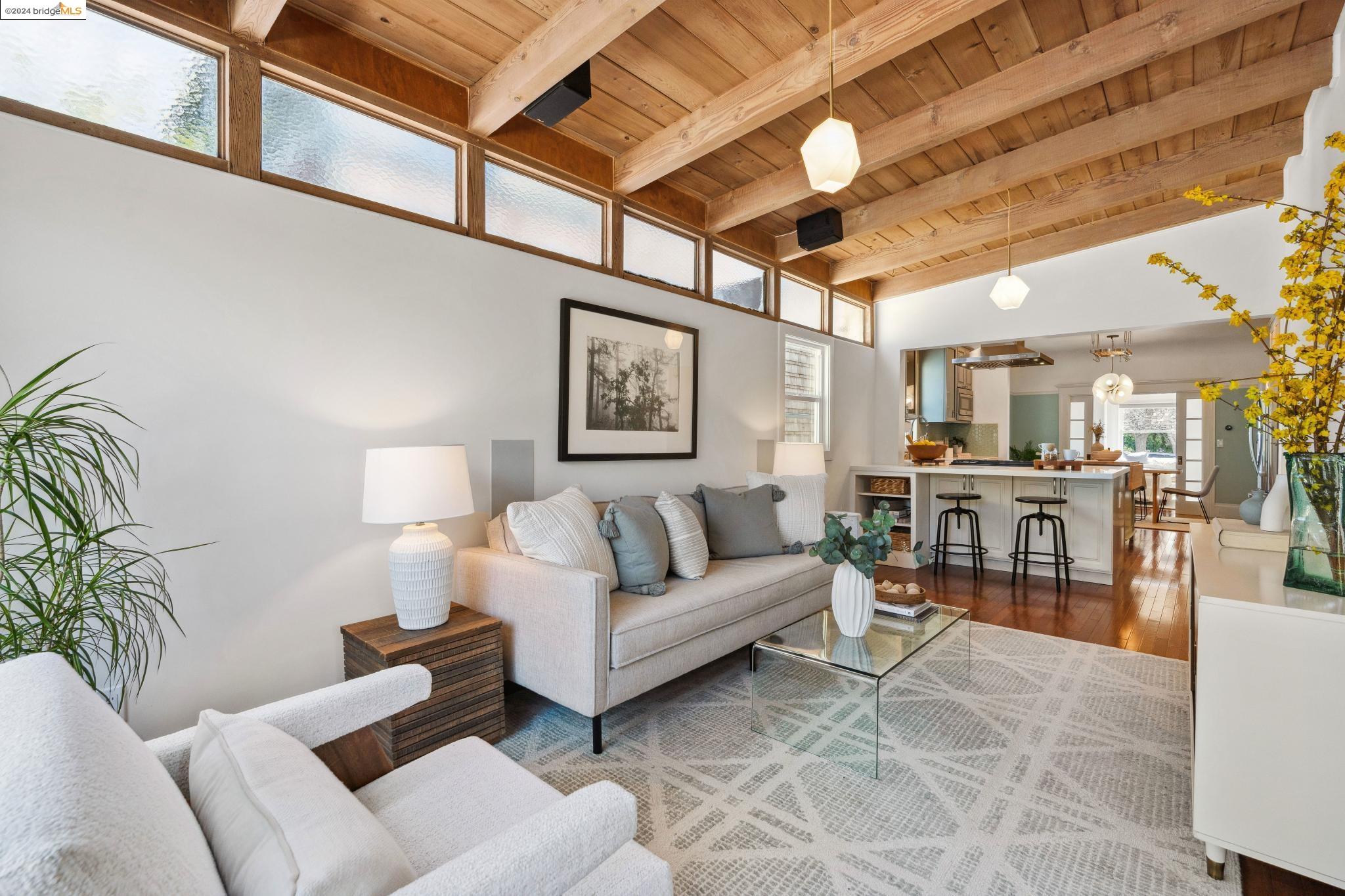 438 65th Street Oakland, CA 94609 - Photo 1 of 1 a living room with furniture a ceiling fan and a rug