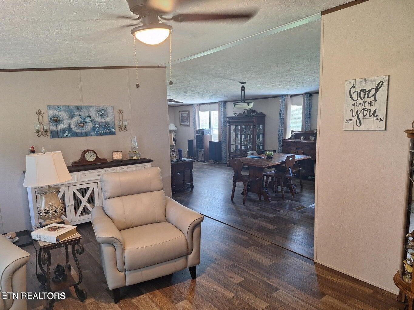 1450 Belltown Road Tellico Plains, TN 37385 - Photo 11 of 32 a living room with furniture and wooden floor