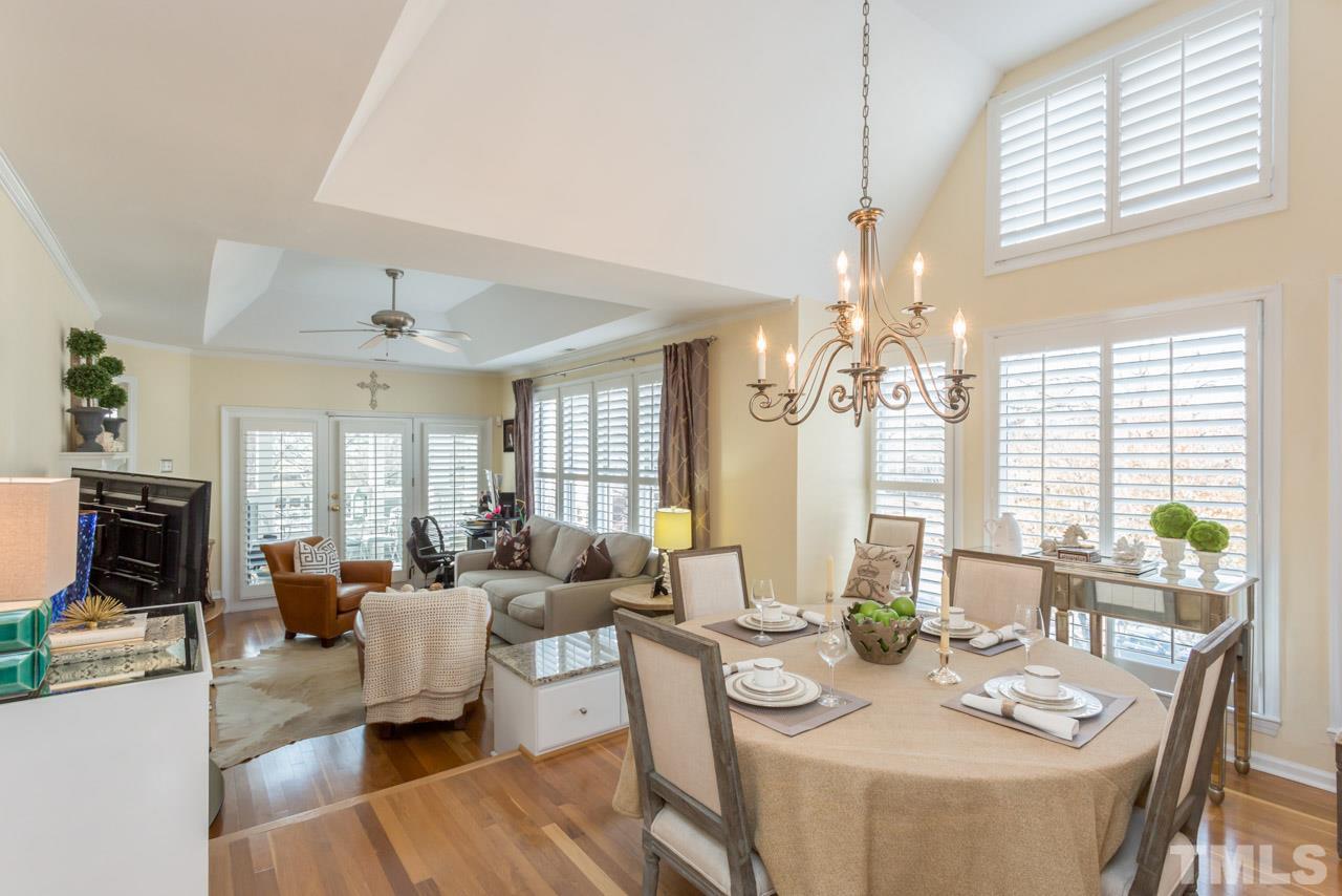 1000 Brighthurst Drive, Unit 301 Raleigh, NC 27605 - Photo 1 of 24 a living room with fireplace furniture and a large window