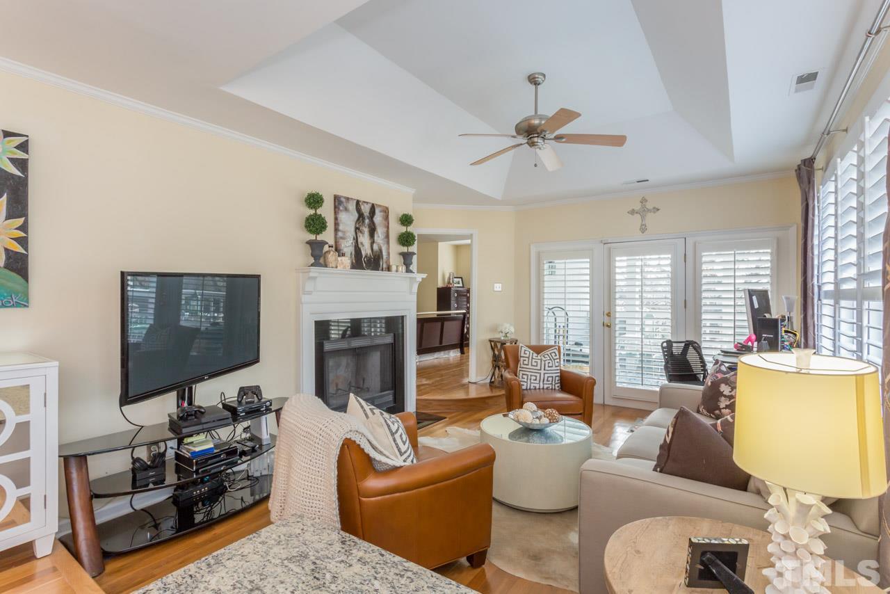 1000 Brighthurst Drive, Unit 301 Raleigh, NC 27605 - Photo 11 of 24 a living room with furniture fireplace and window