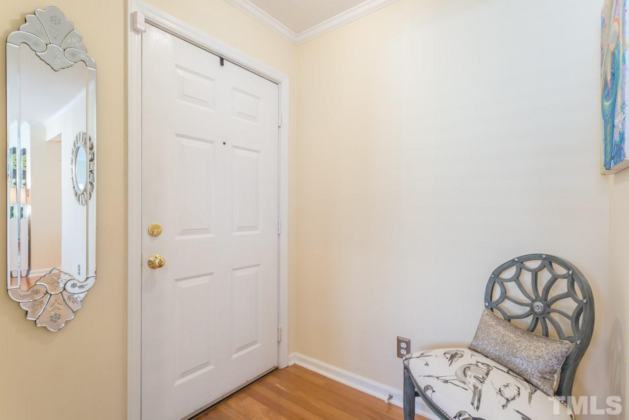 1000 Brighthurst Drive, Unit 301 Raleigh, NC 27605 - Photo 3 of 24 a view of a hallway with wooden floor and closet