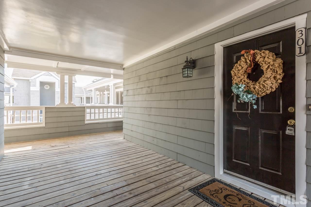 1000 Brighthurst Drive, Unit 301 Raleigh, NC 27605 - Photo 22 of 24 a view of a door and wooden floor